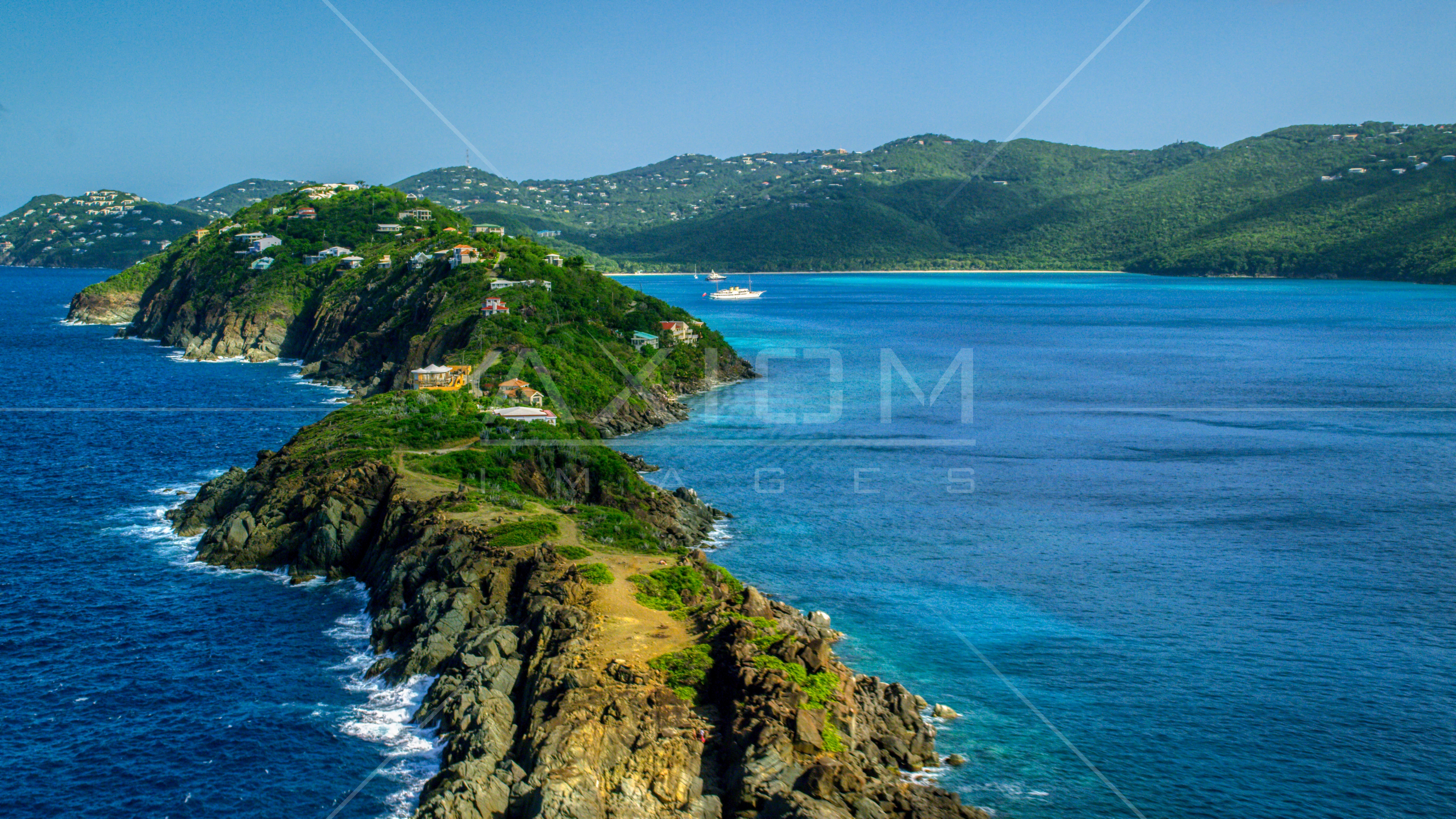 Hillside oceanfront homes by sapphire blue Caribbean waters, Magens Bay
