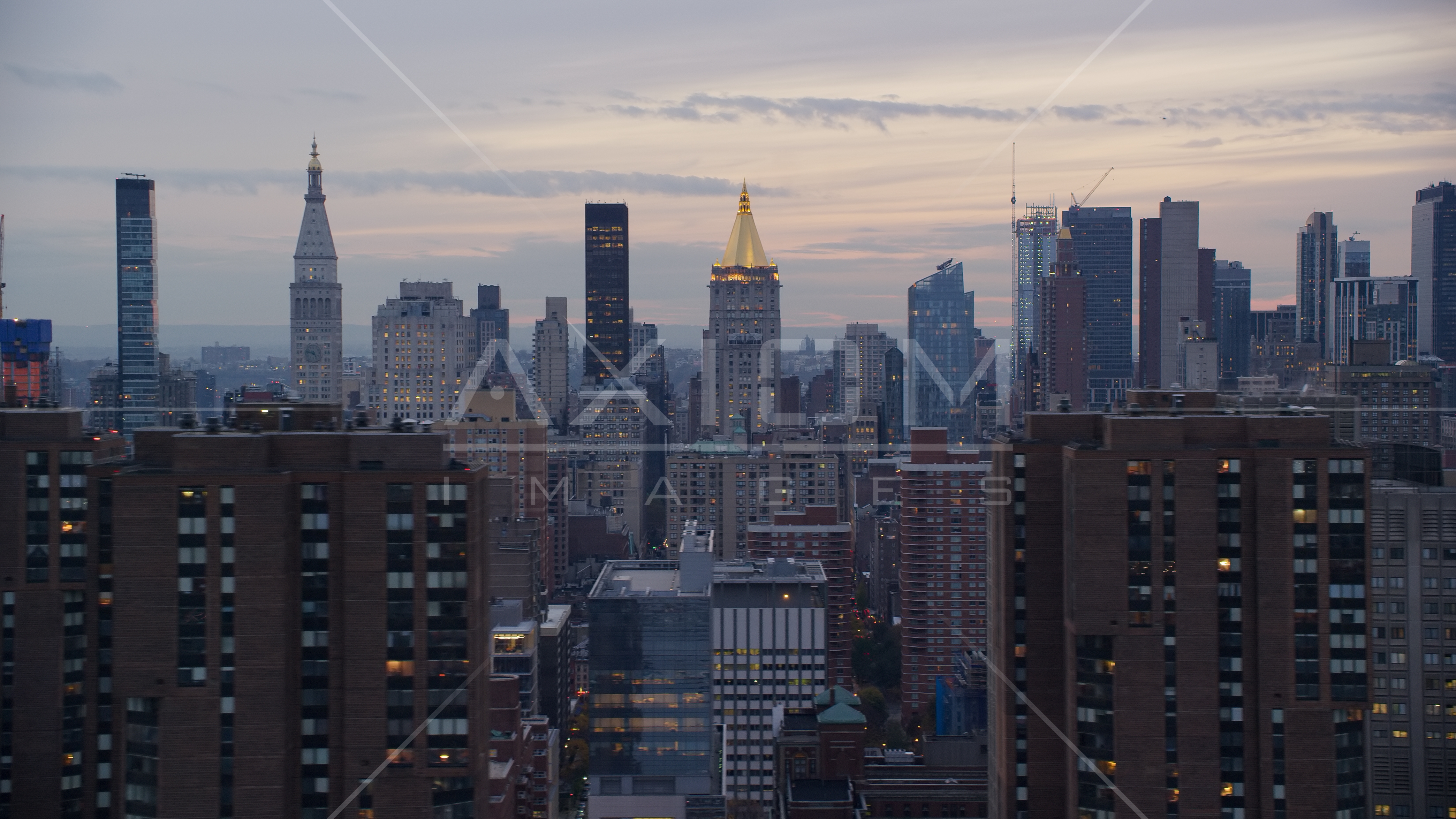 New York Life Building and Midtown skyscrapers at sunset in New York City Aerial Stock Photo