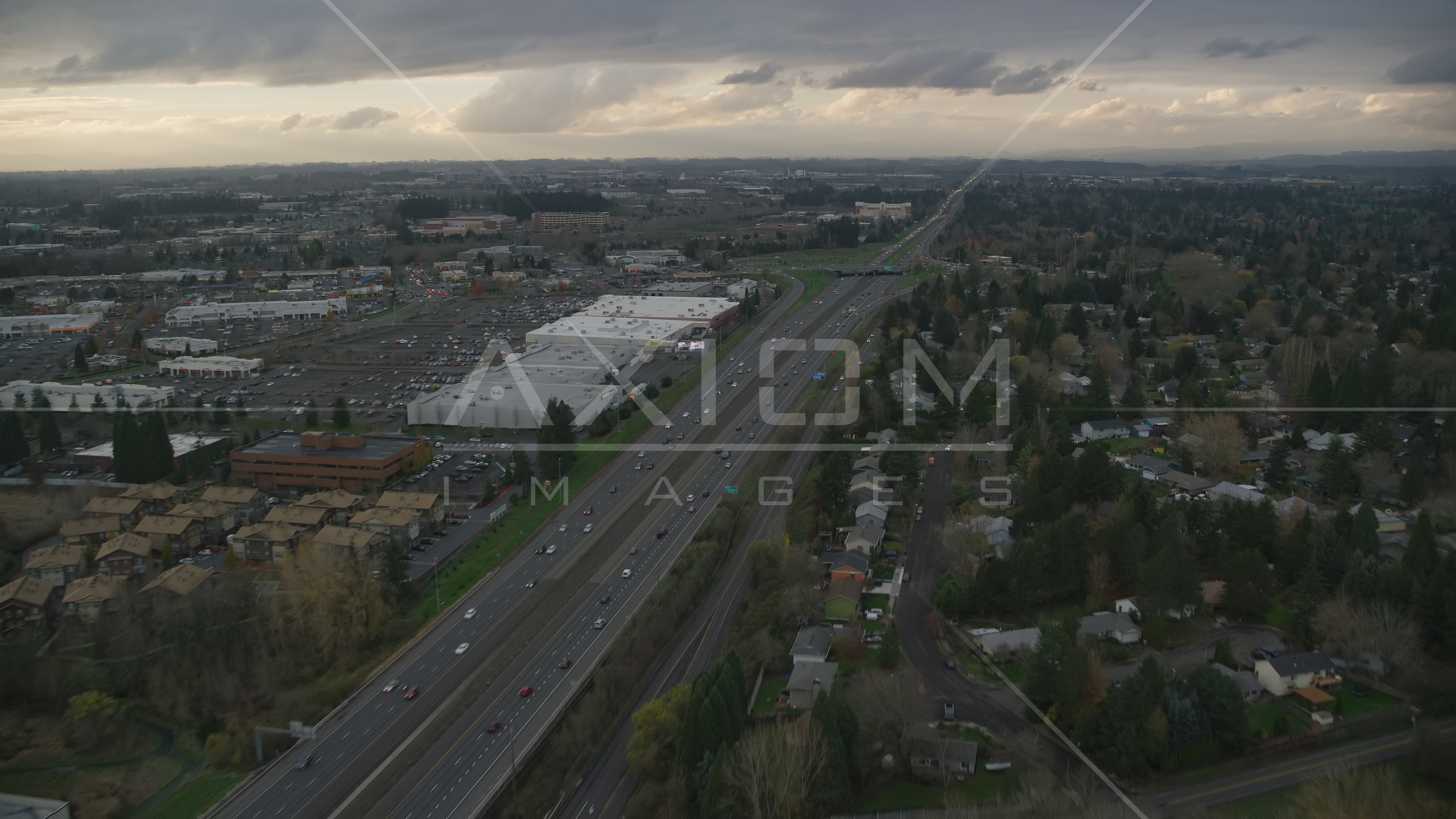 Apartment buildings along Highway 26 by Tanasbourne Town Center in