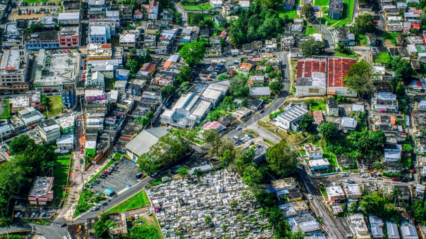 Small town with homes and a cemetary, Ciales, Puerto Rico Aerial Stock Photo AX101_048.0000084F | Axiom Images