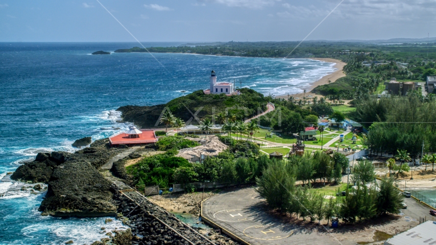 Arecibo Lighthouse on a small hill overlooking the Caribbean, Puerto Rico Aerial Stock Photo AX101_143.0000000F | Axiom Images