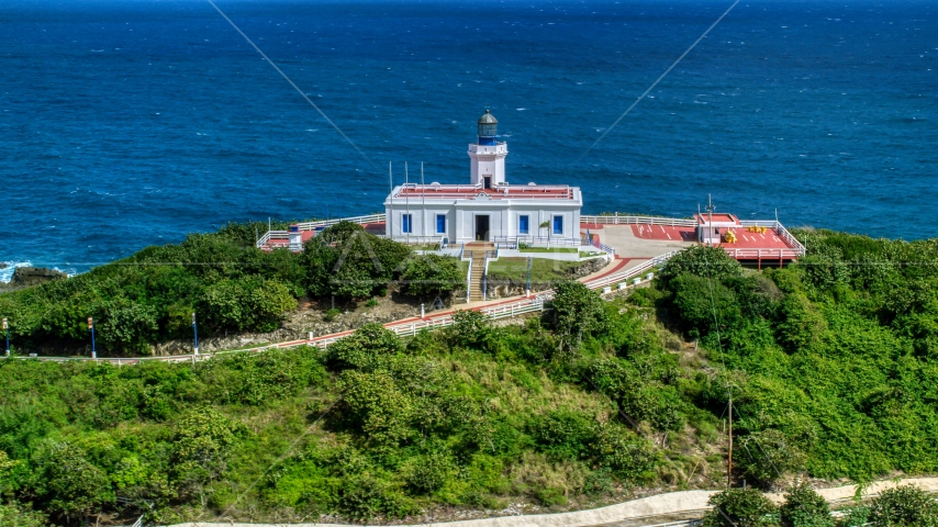 Arecibo Lighthouse beside the coastal waters of the Caribbean, Puerto Rico Aerial Stock Photo AX101_144.0000277F | Axiom Images