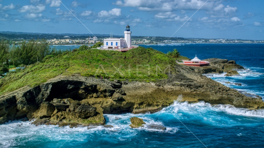 Arecibo Lighthouse on the Caribbean island coast, Puerto Rico Aerial Stock Photo AX101_147.0000000F | Axiom Images