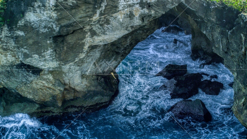 Water-filled sea cave on the coast, Arecibo, Puerto Rico Aerial Stock Photo AX101_164.0000000F | Axiom Images
