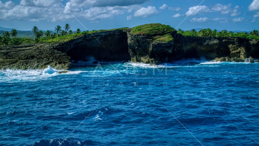 Coastal rock formation and crystal blue water, Arecibo, Puerto Rico Aerial Stock Photo AX101_165.0000000F | Axiom Images