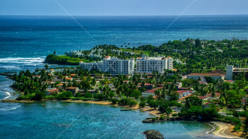 Coastal hotel by pristine blue water, Dorado, Puerto Rico Aerial Stock Photo AX101_217.0000000F | Axiom Images