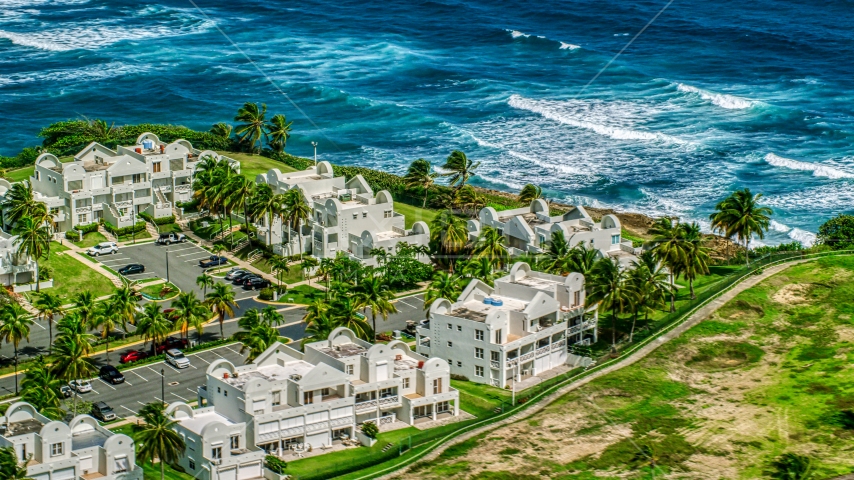 Condominiums on the Caribbean island coast in Dorado, Puerto Rico Aerial Stock Photo AX101_219.0000256F | Axiom Images