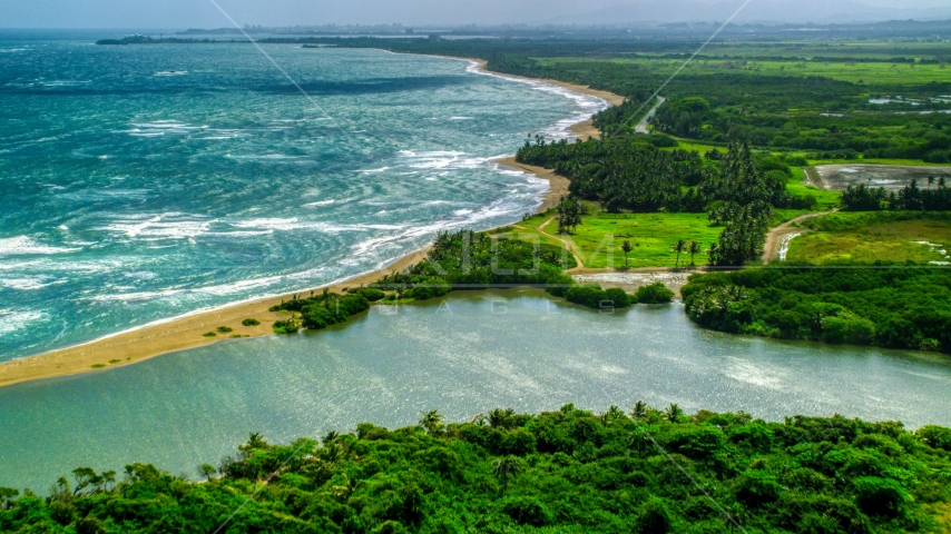 A desert Caribbean island beach and lagoon in Dorado, Puerto Rico Aerial Stock Photo AX101_220.0000000F | Axiom Images