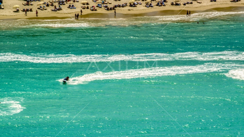 Jet skiers in crystal blue water, Carolina, Puerto Rico Aerial Stock Photo AX102_009.0000217F | Axiom Images