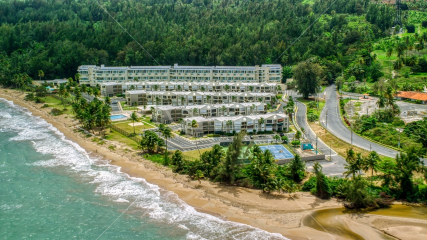 Beach and condominium complex in Rio Grande, Puerto Rico Aerial Stock Photo AX102_038.0000207F | Axiom Images
