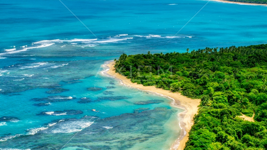Reefs in the crystal blue waters along the Caribbean beach, Luquillo, Puerto Rico Aerial Stock Photo AX102_054.0000000F | Axiom Images