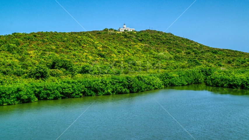 Cape San Juan Light, a hilltop lighthouse in Puerto Rico Aerial Stock Photo AX102_062.0000000F | Axiom Images