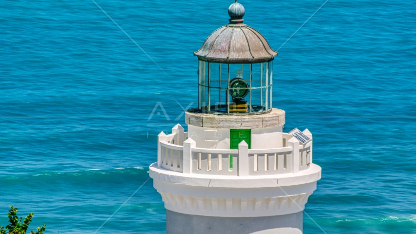 The top of Cape San Juan Light with views of clear blue waters, Puerto Rico Aerial Stock Photo AX102_070.0000071F | Axiom Images