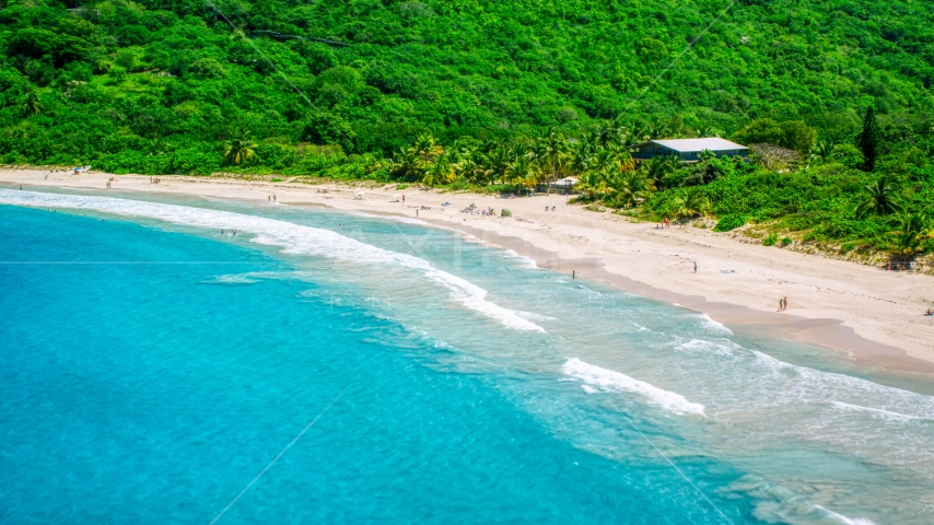 Sapphire blue waters by tourists on a white sand Caribbean beach, Culebra, Puerto Rico Aerial Stock Photo AX102_113.0000000F | Axiom Images