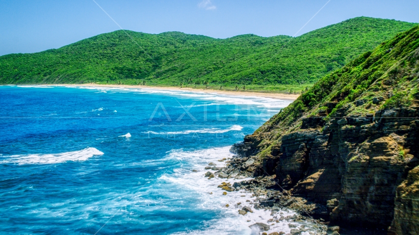 Sapphire blue waters and a Caribbean beach and lush vegetation, Culebra, Puerto Rico Aerial Stock Photo AX102_116.0000040F | Axiom Images