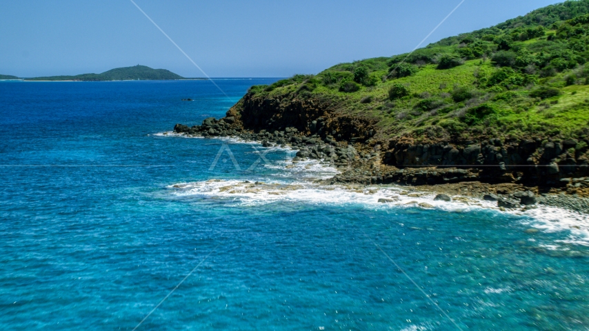 A rugged Caribbean island coast and blue water in Culebra, Puerto Rico Aerial Stock Photo AX102_128.0000342F | Axiom Images