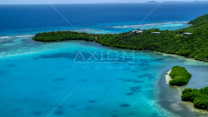 Oceanfront home on the Caribbean island coast of Culebra, Puerto Rico Aerial Stock Photo AX102_136.0000337F | Axiom Images