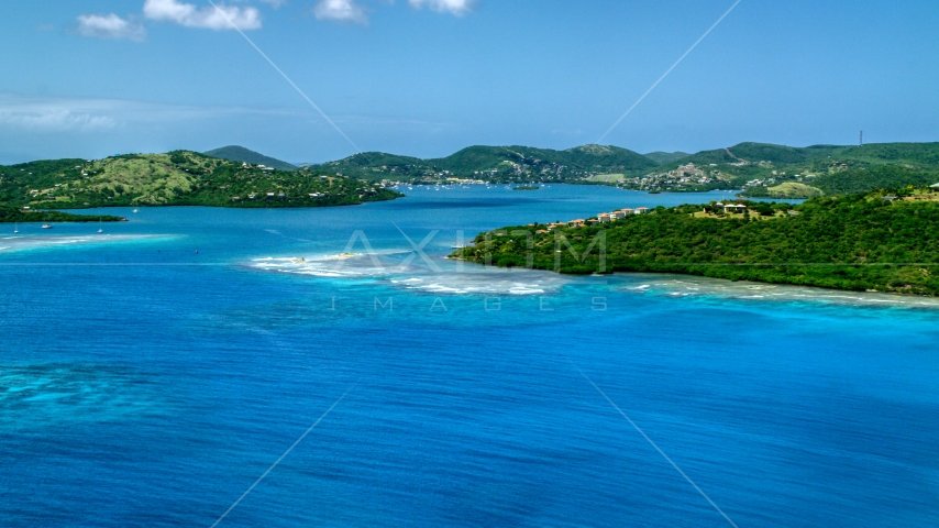 Sapphire blue bay and a coastal island town on Culebra, Puerto Rico Aerial Stock Photo AX102_139.0000000F | Axiom Images