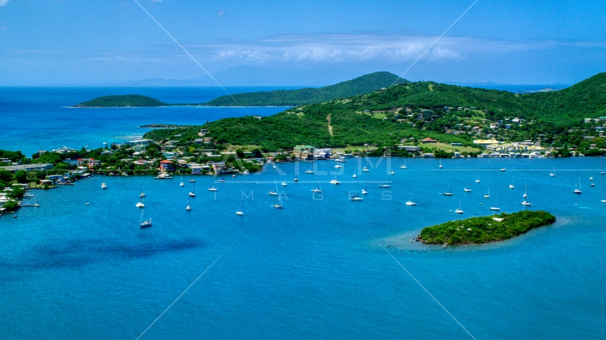 Sail boats in sapphire blue water near a small coastal town, Culebra, Puerto Rico Aerial Stock Photo AX102_142.0000000F | Axiom Images