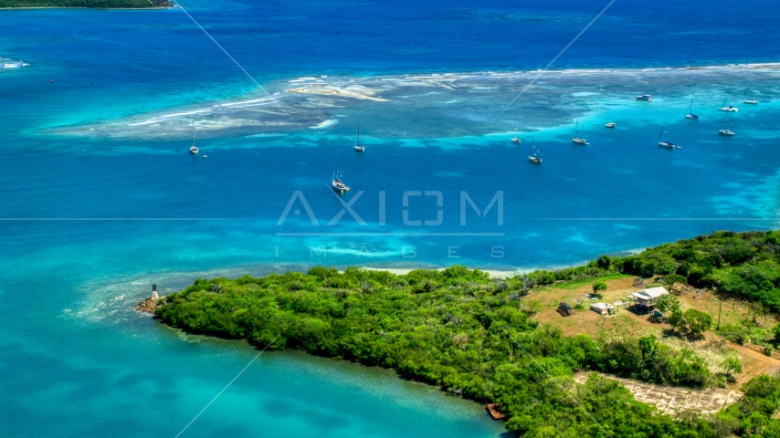 Sailboats near a reef in sapphire blue waters of a harbor Culebra, Puerto Rico Aerial Stock Photo AX102_159.0000283F | Axiom Images