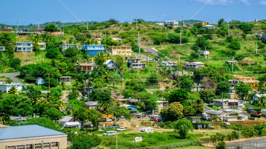 Hillside homes on the Caribbean island of Culebra, Puerto Rico Aerial Stock Photo AX102_165.0000225F | Axiom Images