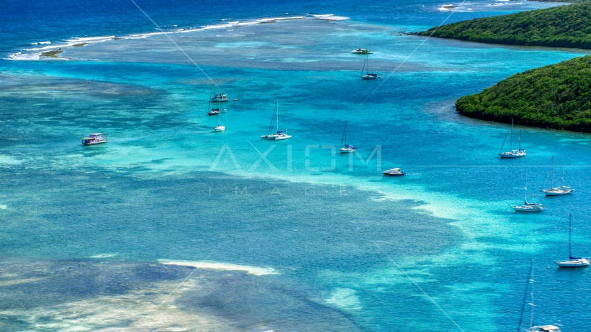 Sailboats anchored in the harbor near reefs in Culebra, Puerto Rico Aerial Stock Photo AX102_169.0000228F | Axiom Images