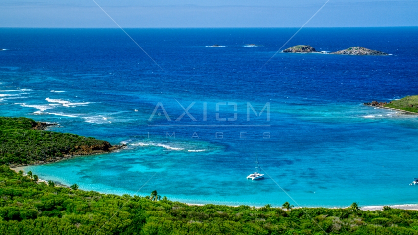 A catamaran near a Caribbean island coast, Culebrita, Puerto Rico Aerial Stock Photo AX102_178.0000257F | Axiom Images