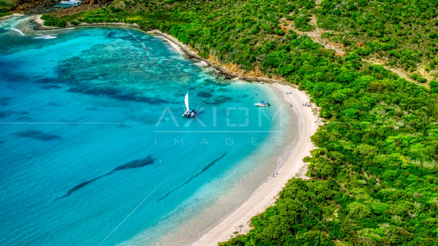 Boats beside a white sand beach on the Caribbean island of Culebrita, Puerto Rico Aerial Stock Photo AX102_180.0000000F | Axiom Images