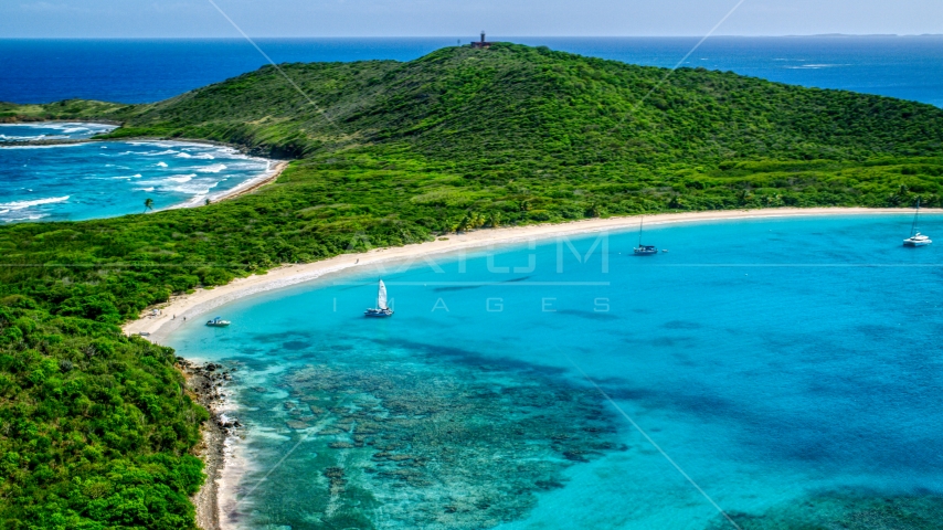 Catamarans in turquoise blue waters beside a white sand Caribbean beach, Culebrita, Puerto Rico Aerial Stock Photo AX102_182.0000000F | Axiom Images