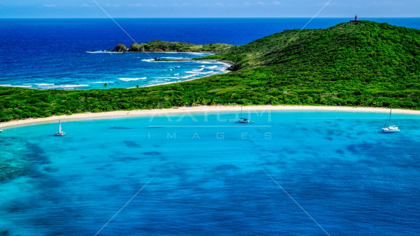 Catamarans in turquoise blue waters beside a white sand Caribbean beach, Culebrita, Puerto Rico Aerial Stock Photo AX102_182.0000258F | Axiom Images