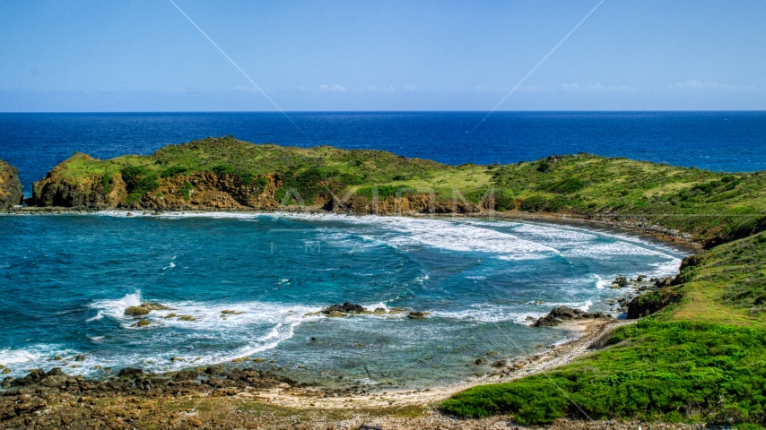 Waves rolling in toward the island coast, Culebrita, Puerto Rico Aerial Stock Photo AX102_190.0000096F | Axiom Images