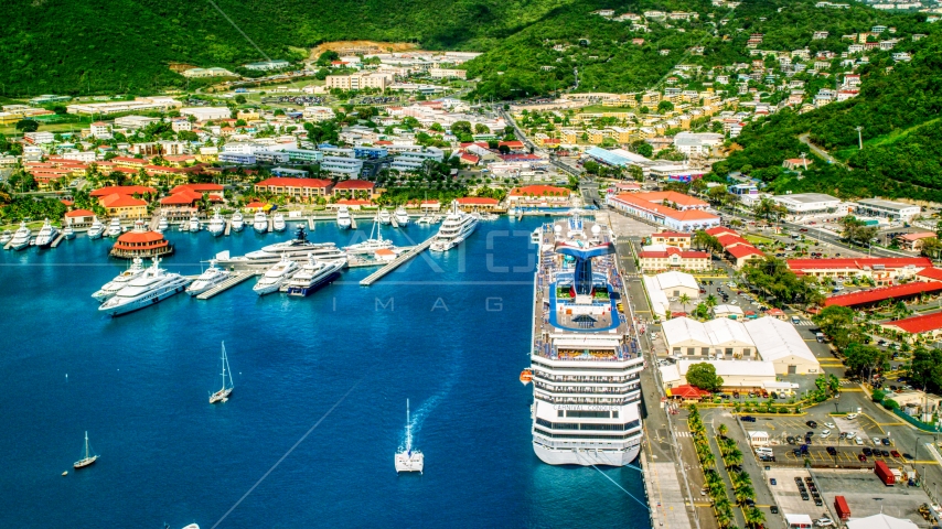 Cruise ship and yachts docked in sapphire waters at a Caribbean island town, Charlotte Amalie, St. Thomas Aerial Stock Photo AX102_210.0000000F | Axiom Images