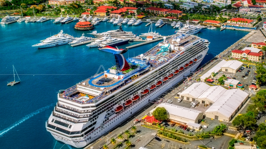 Cruise ship and yachts anchored in sapphire waters of a Caribbean island town, Charlotte Amalie, St. Thomas Aerial Stock Photo AX102_210.0000272F | Axiom Images