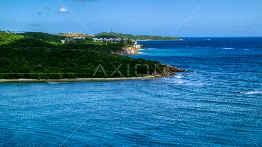 Oceanfront condominiums overlooking sapphire blue waters, Southside, St Thomas Aerial Stock Photo AX102_235.0000000F | Axiom Images