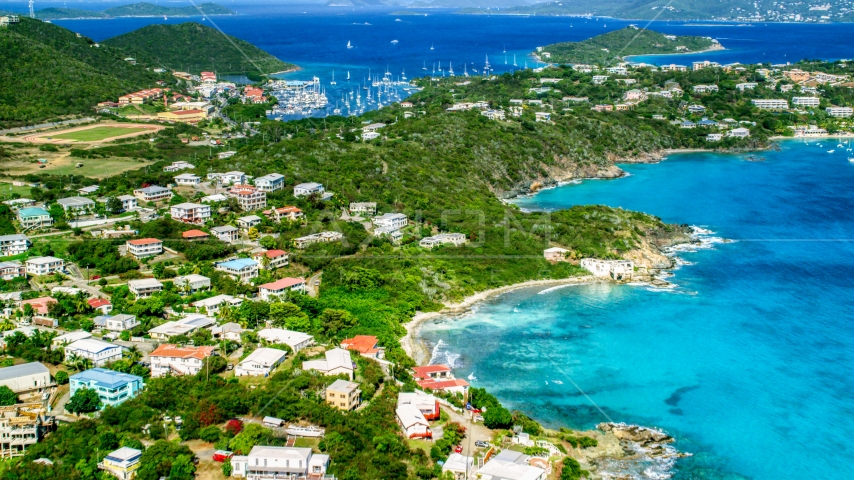Island homes on the coast near a marina in Red Hook, St Thomas, the US Virgin Islands Aerial Stock Photo AX102_240.0000000F | Axiom Images