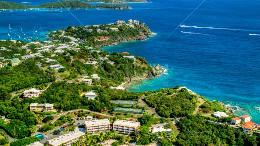 Upscale oceanfront homes beside sapphire blue waters, East End, St Thomas Aerial Stock Photo AX102_246.0000000F | Axiom Images