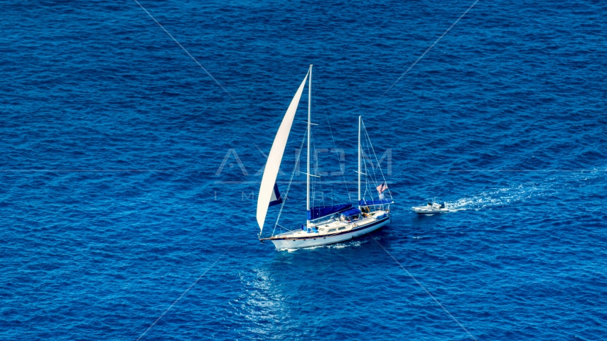 Sailboat in sapphire blue waters, St Thomas, USVI Aerial Stock Photo AX102_255.0000094F | Axiom Images