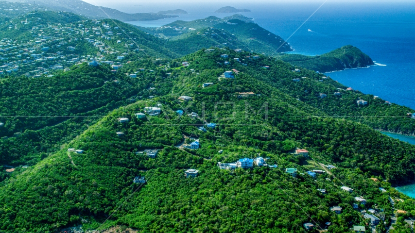 Hilltop island homes over looking the blue ocean waters by the coast, East End, St Thomas Aerial Stock Photo AX102_259.0000000F | Axiom Images