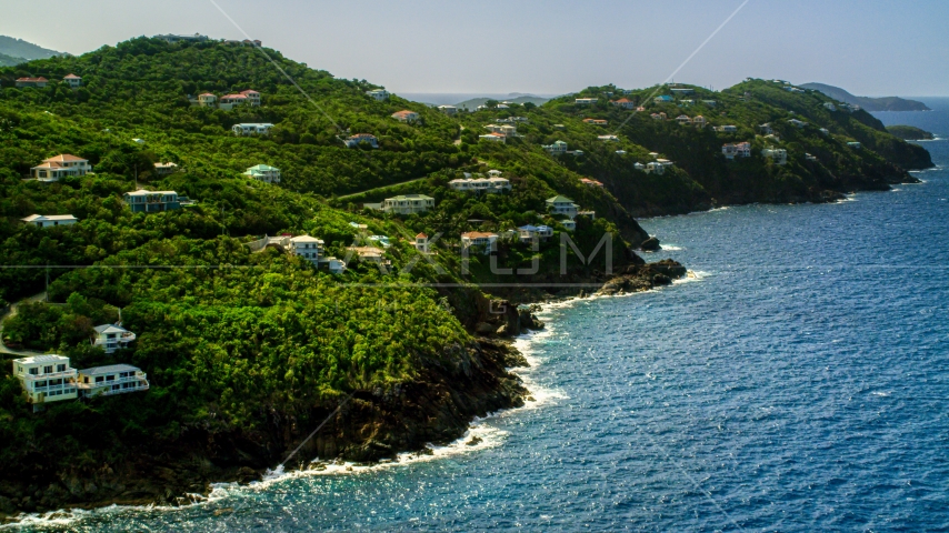 Hillside mansions on an island coast overlooking the ocean, Northside, St Thomas Aerial Stock Photo AX102_267.0000000F | Axiom Images