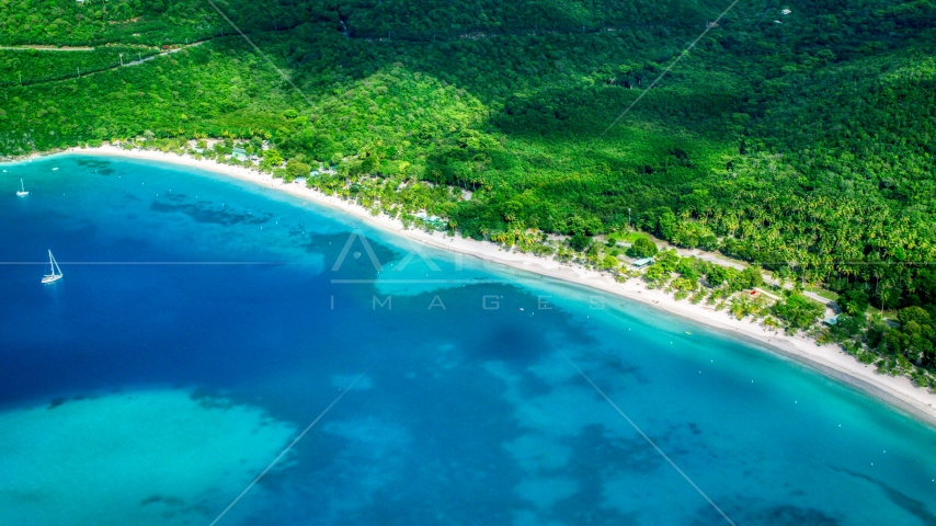 White sand Caribbean island beach and turquoise blue waters, Magens Bay, St Thomas Aerial Stock Photo AX102_270.0000000F | Axiom Images