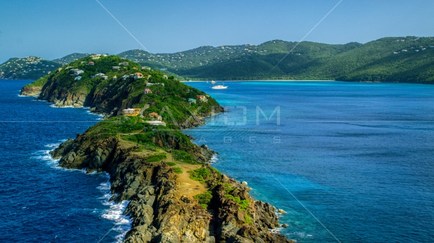 Hillside oceanfront homes by sapphire blue Caribbean waters, Magens Bay, St Thomas Aerial Stock Photo AX102_280.0000000F | Axiom Images