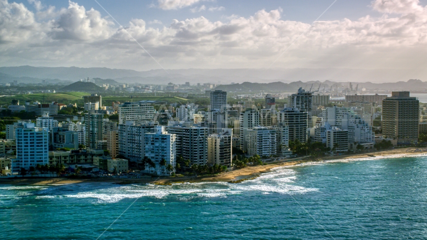 Condo complexes along Caribbean blue waters, San Juan, Puerto Rico Aerial Stock Photo AX103_149.0000224F | Axiom Images