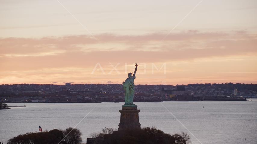 Statue of Liberty with a view of Brooklyn at sunrise, New York Aerial Stock Photos AX118_041.0000196F