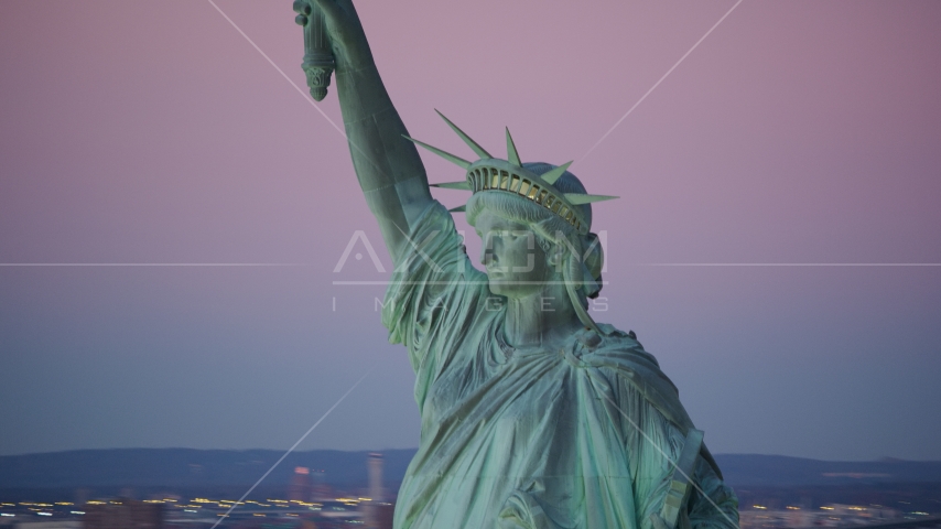Profile of the Statue of Liberty at sunrise, New York Aerial Stock Photos AX118_060.0000000F