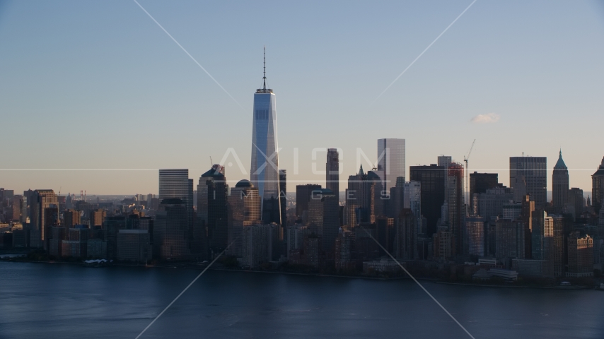 The Lower Manhattan skyline across the Hudson River at sunrise in New York City Aerial Stock Photos AX118_150.0000000F