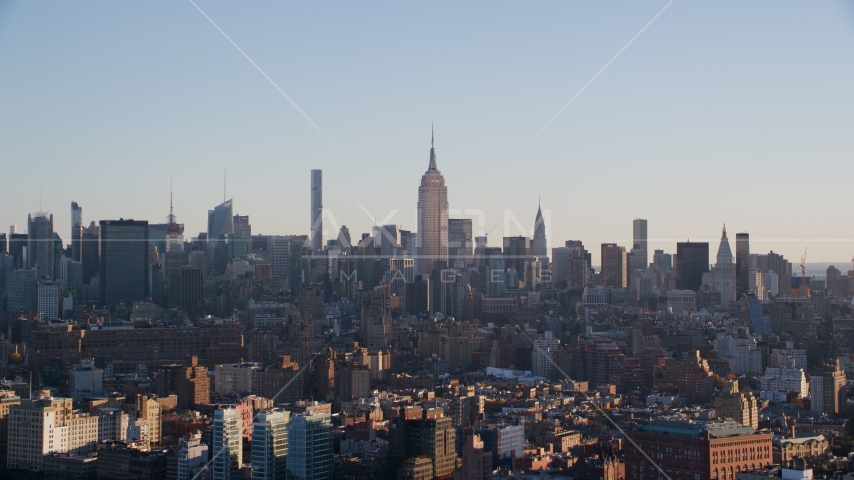 The Empire State Buildings and Midtown skyscrapers at sunrise in New York City Aerial Stock Photos AX118_157.0000074F