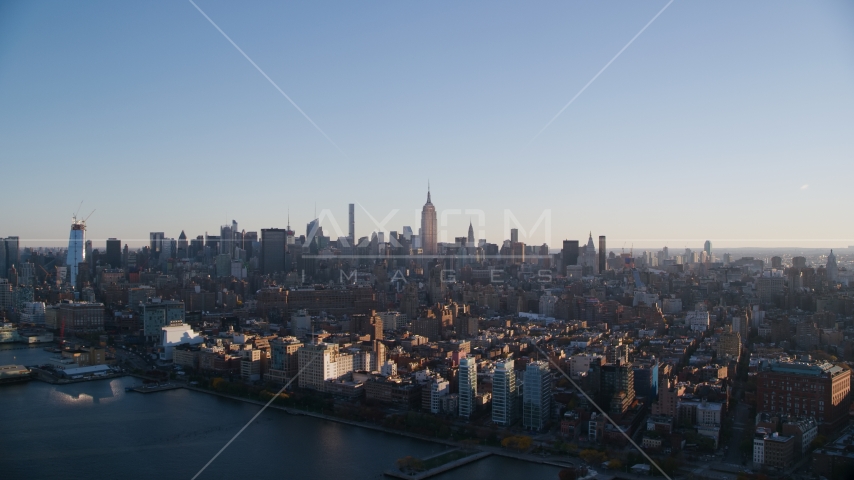 Midtown Manhattan seen from Chelsea at sunrise in New York City Aerial Stock Photo AX118_158.0000100F | Axiom Images
