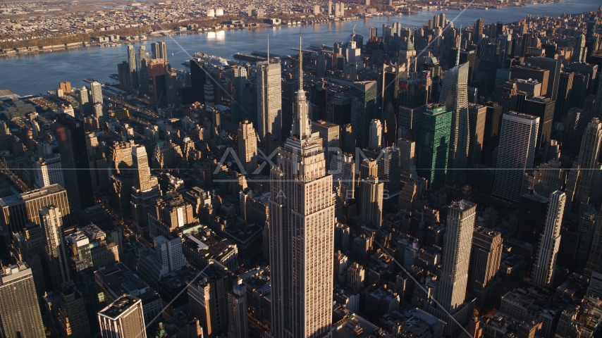 Empire State Building at sunrise in Midtown Manhattan, New York City Aerial Stock Photos AX118_181.0000135F