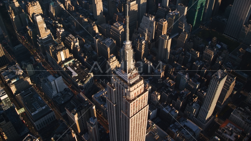 Empire State Building and spire at sunrise in Midtown Manhattan, New York City Aerial Stock Photos AX118_182.0000195F