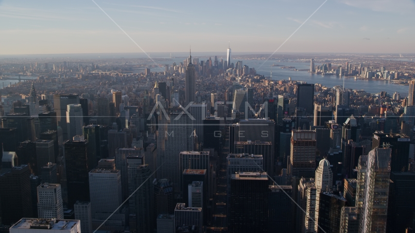 Midtown and Downtown Manhattan skyscrapers at sunrise in New York City Aerial Stock Photos AX118_198.0000141F